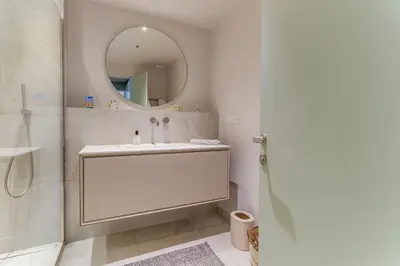 a bathroom with a sink and a mirror at MONT BORON PALMS AP4480 by Riviera Holiday Homes in Nice