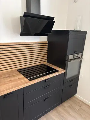 a kitchen with a stove top oven next to a counter at Renovated F3 Parking Clim Nice Mont Boron in Nice