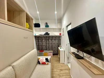 a living room with a flat screen tv on a wall at Studette tout équipée centre ville de Nice in Nice