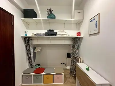 a room with a shelf and a table with colors at Studette tout équipée centre ville de Nice in Nice