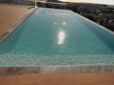 a large swimming pool on top of a building at SEASIDE VIEW Saint Laurent in Saint-Laurent-du-Var