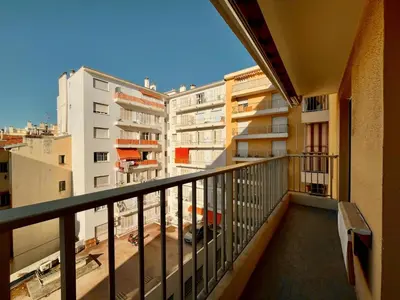 a balcony with a view of some buildings at Beautiful 2 bedroom apartment Port - 5 min to beaches in Nice