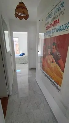 a hallway with a large movie poster on the wall at Beautiful 2 bedroom apartment Port - 5 min to beaches in Nice