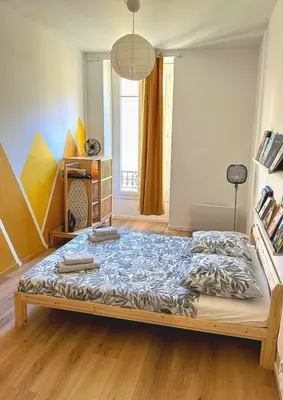 a bedroom with a large bed in a room at Heart of Nice Beautiful apartment 3 bedrooms in Nice