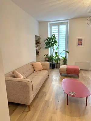 a living room with a couch and a table at Heart of Nice Beautiful apartment 3 bedrooms in Nice