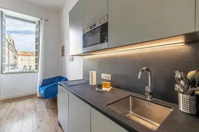 a kitchen with a sink and a counter top at Residence Garibaldi - Nice in Nice
