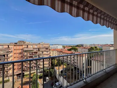 a balcony with a view of a city at Douceur azuréenne - Wifi, Parking, vue mer, 4pers in Nice