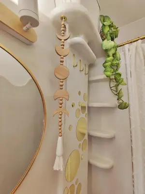 a bathroom with a shelf with spoons on the wall at Studio Jungle Bohème - à 3 min de la Promenade des anglais à pieds in Nice