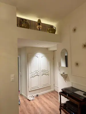 a room with a white door and a piano at Beautiful luxurious apartment in Nice