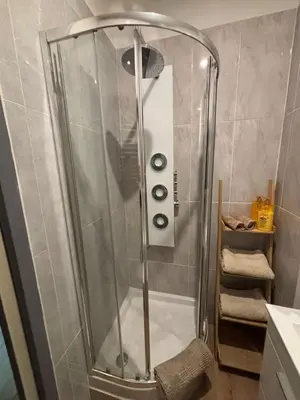 a shower with a glass door in a bathroom at Studio proche gare in Nice