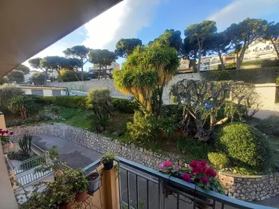 a view of a garden from a balcony at Apartement ensoleillé vue mer in Villefranche-sur-Mer
