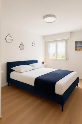 a bedroom with a large bed in a room at Appartement confortable avec balcon - Proche Gare Riquier SNCF in Nice