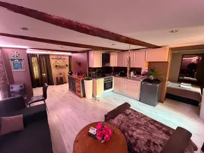 a living room with a couch and a table at Beautiful apartament 2 pièce Nice center in Nice