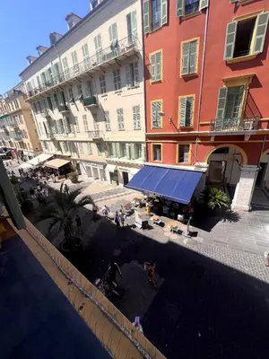 an overhead view of a courtyard in front of buildings at Duplex Place Massena in Nice