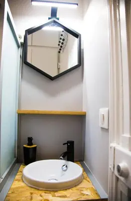 a bathroom with a white sink and a mirror at Studio port de Nice in Nice