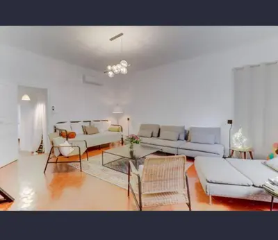 a living room with two couches and a table at Exceptional Location Beaches Cours SALEYA in Nice