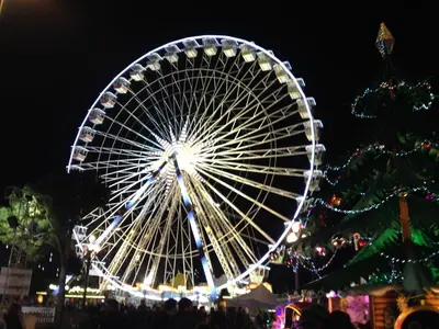 a large ferris wheel at night with christmas lights at Nice Renting - PAGANINI - New Lovely Cosy Flat in Heart of Nice in Nice