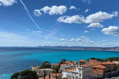 a view of a city and the ocean at Superb apartment with exceptional sea view in Nice