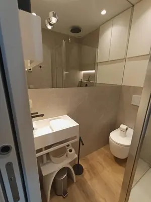 a bathroom with a sink and a toilet at Superb apartment with exceptional sea view in Nice