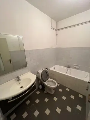 a bathroom with a sink and a toilet and a tub at T2 Pasteur in Nice
