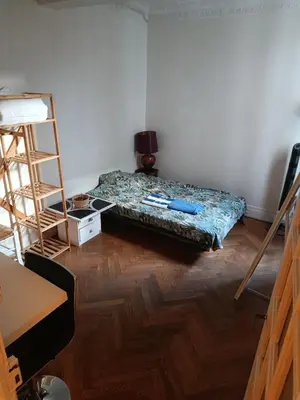 a room with a bed and a ladder in it at Chambre niçoise in Nice