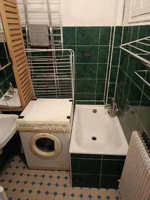 a bathroom with a toilet and a sink at Chambre niçoise in Nice