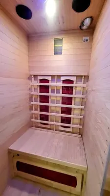a living room with a table and a couch at WeHost D1 - Sea, Sauna & Sun - Studio 2pers in Nice