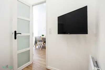 a bathroom with a white sink and two mirrors at WeHost D3 - La cour du Sauna 2 beds, 4 people in Nice
