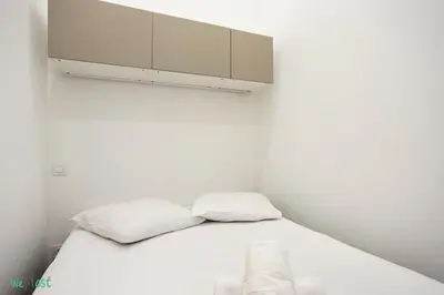 a bathroom with a white sink and a mirror at WeHost D3 - La cour du Sauna 2 beds, 4 people in Nice
