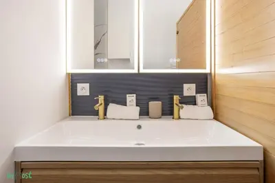 a living room with a table and chairs at WeHost D3 - La cour du Sauna 2 beds, 4 people in Nice