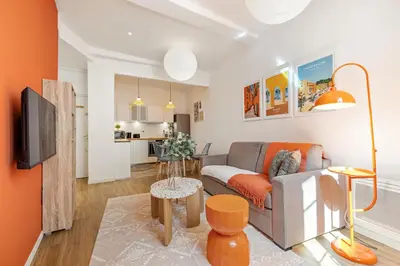 a living room with a couch and a table at Nice Renting - COLLET - Cocoon Design Old Nice Beach Massena Saleya in Nice