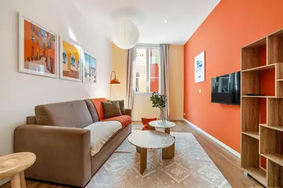 a living room with a couch and a table at Nice Renting - COLLET - Cocoon Design Old Nice Beach Massena Saleya in Nice