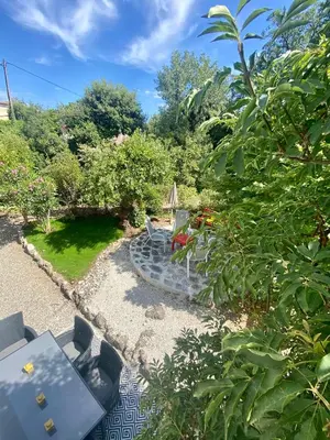 a view of a garden with a stone path at Villa Nice Côte d'Azur piscine privée rez de chaussée in La Gaude