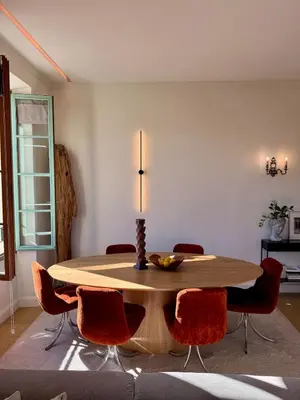 a dining room table with chairs and a candle on top at Central & Beach in Nice