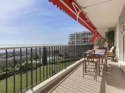 a balcony with a table and chairs and a view at Apartment Le Sirius by Interhome in Nice