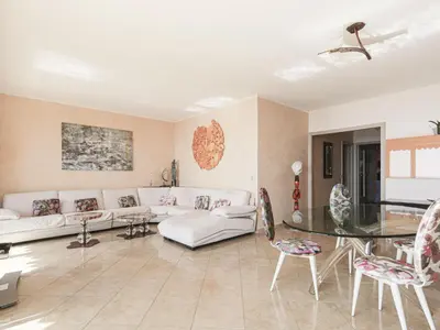 a living room with a couch and a table at Apartment Le Sirius by Interhome in Nice