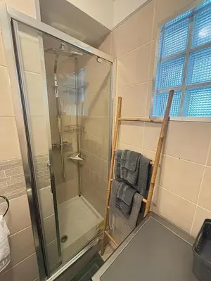 a bathroom with a shower and a glass shower stall at Cosy one bedroom apartment to Nice in Nice