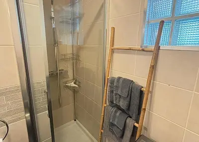 a bathroom with a shower with a glass door at Cosy one bedroom apartment to Nice in Nice