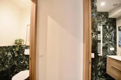 a bathroom with a toilet and a sink at Nice Signature The Port in Nice