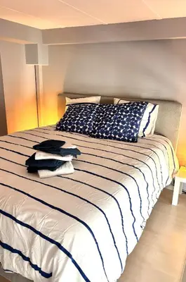a bedroom with a large bed with towels on it at Beautiful Carré d'Or studio in Nice