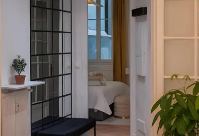 a room with a bed and a window at Azur elegance AIR CONDITIONING Beach 8 min Sleeps 6 in Nice