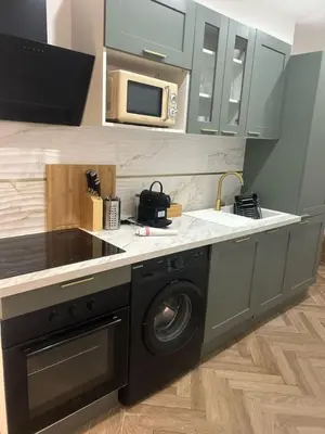 a kitchen with a washing machine and a microwave at MOON 26 - Appartement Nice 6P in Nice