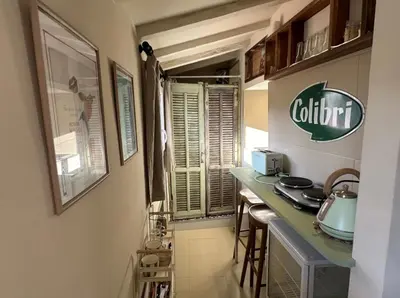 a small kitchen with a counter and a counter top at Studio Place Rossetti - Old Nice Center in Nice
