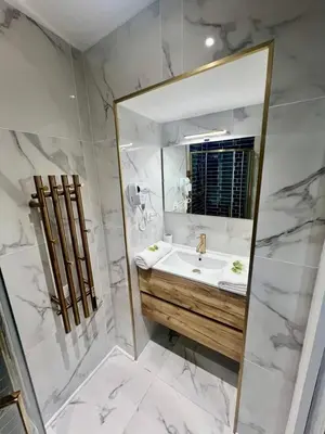 a bathroom with a sink and a mirror at MASSENA 27 in Nice