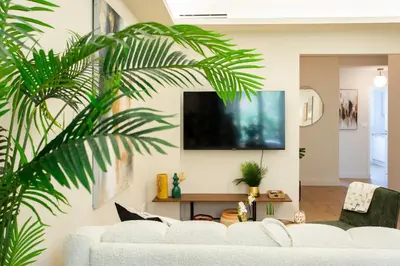 a living room with a white couch and a tv at L9 Marechal 2BDR Marechal, 5 min Sea10 min Old Town Parking AC in Nice