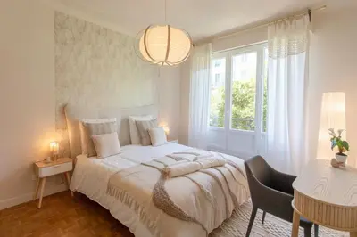 a bedroom with a large white bed and a window at L9 Marechal 2BDR Marechal, 5 min Sea10 min Old Town Parking AC in Nice