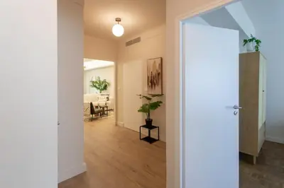 an open door leading into a living room with a dining room at L9 Marechal 2BDR Marechal, 5 min Sea10 min Old Town Parking AC in Nice