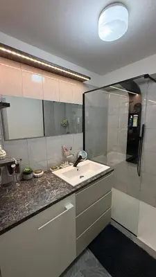 a bathroom with a sink and a shower at Modern apartment with sunny terrace in Nice