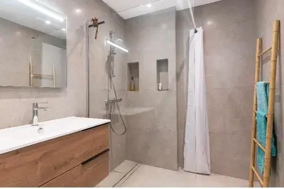 a bathroom with a shower and a sink at Absea Nice Port 2 in Nice