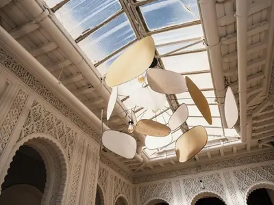 a skylight in a building with a chandelier at Appartement Haut Standing coeur de Nice pour 6pers in Nice